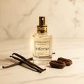 Inferno Perfume on cream marble with vanilla beans and tonka